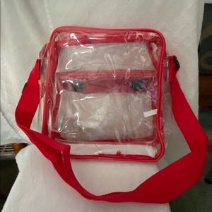 Stadium approved clear handbag. Red Trim